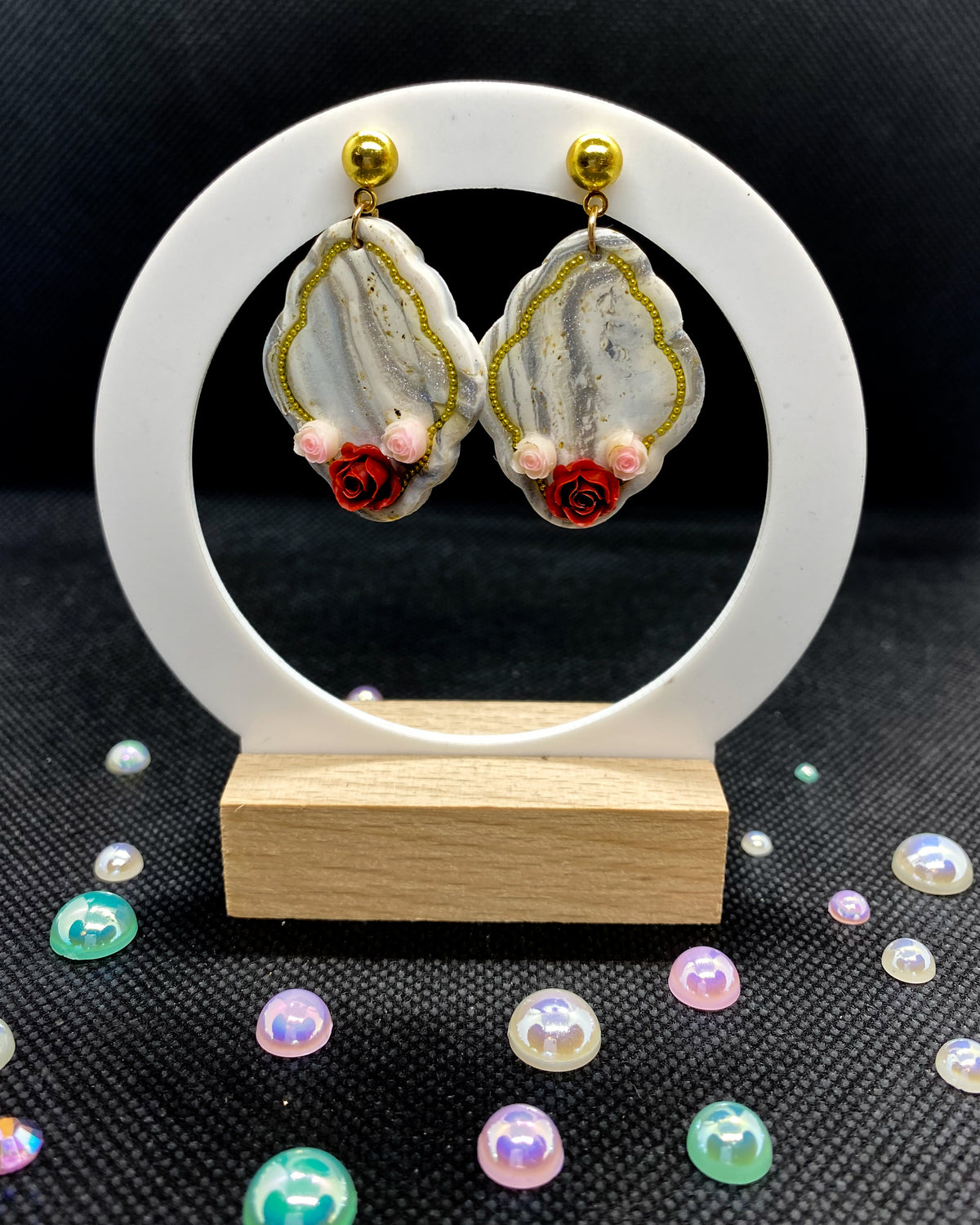 Pair of white and silver marbled clay earrings with red roses, pink flowers and gold-tone details