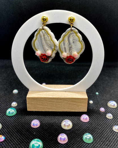 Pair of white and silver marbled clay earrings with red roses, pink flowers and gold-tone details